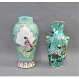 Chinese green glazed baluster vase with dragon pattern and moulded mask heads to side, together with