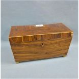 19th century rosewood veneered tea caddy with hinged lid on four brass bun feet, 31 x 17cm