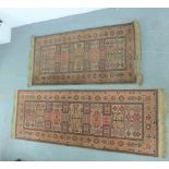 Pair of Eastern runners, with rust coloured field and border, 70 x 190cm, (2)