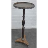 Mahogany wine table with circular dished top on a fluted column and triform base, 76 x 30cm
