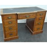 Mahogany writing desk with break front above a central frieze drawer flanked by four short