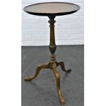 Mahogany pedestal wine table with circular top on a baluster turned column and tripod supports, 66 x