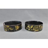 Pair of papier mache lacquered and gilded wine coasters, 14cm diameter, (2)