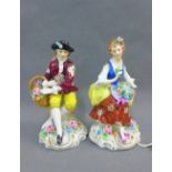 Pair of Sitzendorf 'Flower Seller' male and female figures, 13cm high, (2)