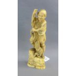 Japanese Meiji period ivory Okimono of a Bird Catcher standing on a rock surrounded by waves, signed