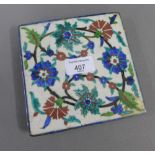 Iznik tile with scrolling floral pattern and blue rim, 15 x 15cm