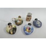 A collection of late 19th/early 20th century porcelain scent bottles to include three heart shaped