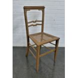 An oak chair with canework seat