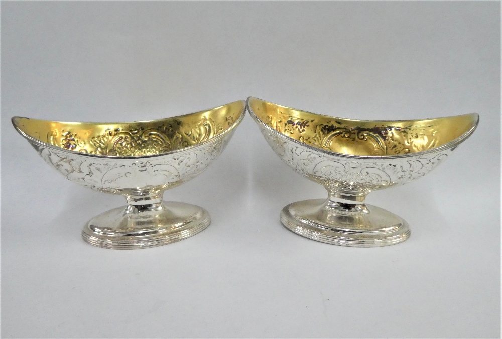 A pair of George III silver gilt boat shaped salts, William Abdy I, London 1788, on reeded