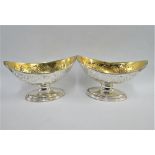A pair of George III silver gilt boat shaped salts, William Abdy I, London 1788, on reeded
