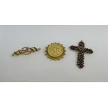 Edwardian 9 carat gold thistle bar brooch, Chester 1906 together with a garnet set crucifix and a