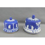 Two blue and white Jasper cheese bells with covers, (2)