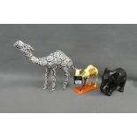 Art works Caravan pottery figure together with a resin camel and a black glazed pottery elephant