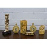 A collection of seven bone carvings, to include a female figure, a cow stamp, a brush pot and