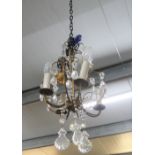 Small chandelier with gilt metal mounts and clear glass droplets