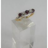 18 carat gold and platinum five stone ruby and diamond ring.