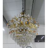 Large brass chandelier with clear and amber coloured drops, approx 45cm across
