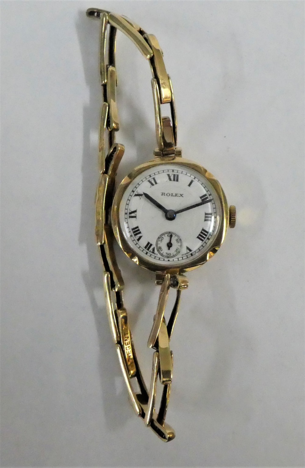 Lady's 9 carat gold cased Rolex wristwatch on 9 carat gold bracelet strap