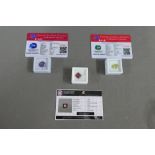Three unmounted gemstones to include a Ruby, a Peridot and a Tanzanite, with certificates (3)
