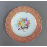 Royal Crown Derby floral painted cabinet plate with a pink and gilt border, with printed back stamp,