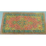 Turkish rug with central medallion and foliate border, 174 x 90cm