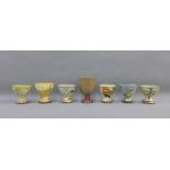 Collection of six Maureen Minchin (b. 1954) studio pottery egg cups, painted with birds,