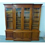 19th century mahogany breakfront bookcase cabinet, the cornice top over four glazed doors with a