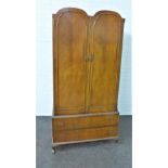Mahogany wardrobe with two arched doors over a pair of long drawers, on cabriole legs 186 x 93cm