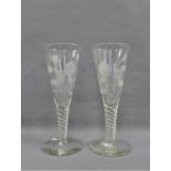 Pair of oversized spiral stem Jacobite style glasses floral etched, spiral stems and conical foot