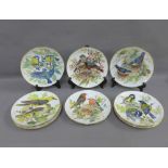 Set of eight WWF German porcelain plates, painted with different bird patterns, (8)