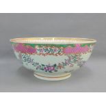 Chinese famille rose porcelain punch bowl painted with flowers and foliage with a pink scale and