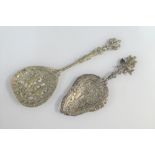 Two silver ornate spoons with pierced bowls, one with cherubs - stamped 'silver made in Italy' and