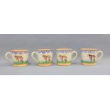 Set of four Nicholas Mosse pottery Cow patterned mugs, (4)