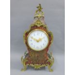French boule work style clock with brass mounts, the enamel dial with Arabic numerals, 30cm high