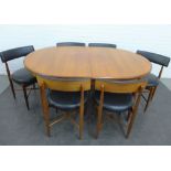 G-Plan extending dining table and set of six chairs, with black vinyl toprails and seats, with cross
