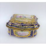 French porcelain box, the hinged lid painted with figures within a gilded border against a blue