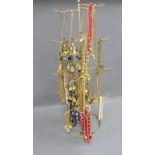Jewellery stand containing a quantity of gilt metal and costume chains and bracelets, etc (a lot)