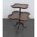 Mahogany two tier whatnot with pierced rims, on carved on tripod legs, 90 x 65cm
