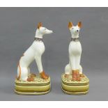 Pair of Librasco pottery dog figures on oval bases, 22.5cm high (2)