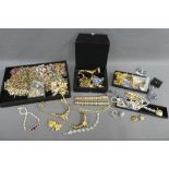 A large quantity of costume jewellery to include necklaces, brooches and clip on earrings, etc (a