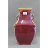 Chinese Sang de Boeuf glazed vase with loop handles to side, with impressed Qianlong mark to the