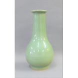 Chinese Celadon glazed bottle neck vase with flat and flared rim, 19.5cm high