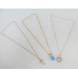 Three 9 carat gold pendant necklaces to include a crucifix, etc (3)