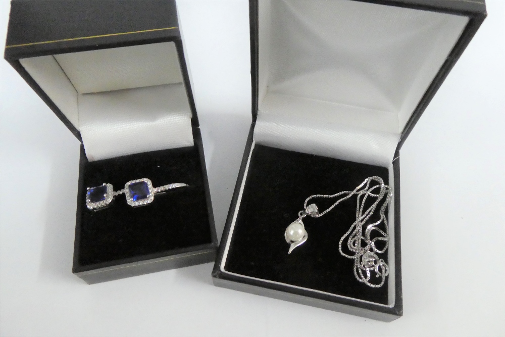 A pair of silver gemset earrings together with a silver pendant necklace (2)