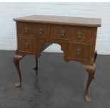 Mahogany desk, the rectangular top above an arrangement of four drawers, on cabriole legs, 72 x 81cm