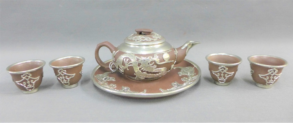 Yixing style white metal mounted miniature teapot together with a circular tray and four cups (6)