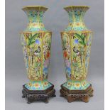 Pair of hexagonal high shouldered baluster vases with flared rims, with bird, flowers and foliage