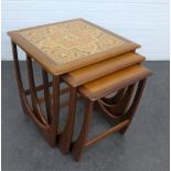 Teak nest of three tables, the largest with tiled top, 52 x 51cm (3)
