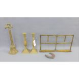 Brass wares to include a pair of knop stemmed candlesticks, a music stand, a door stop and an iron