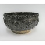 Indian silver bowl with repousee figures and plain circular footrim, 167 grams, 11cm diameter